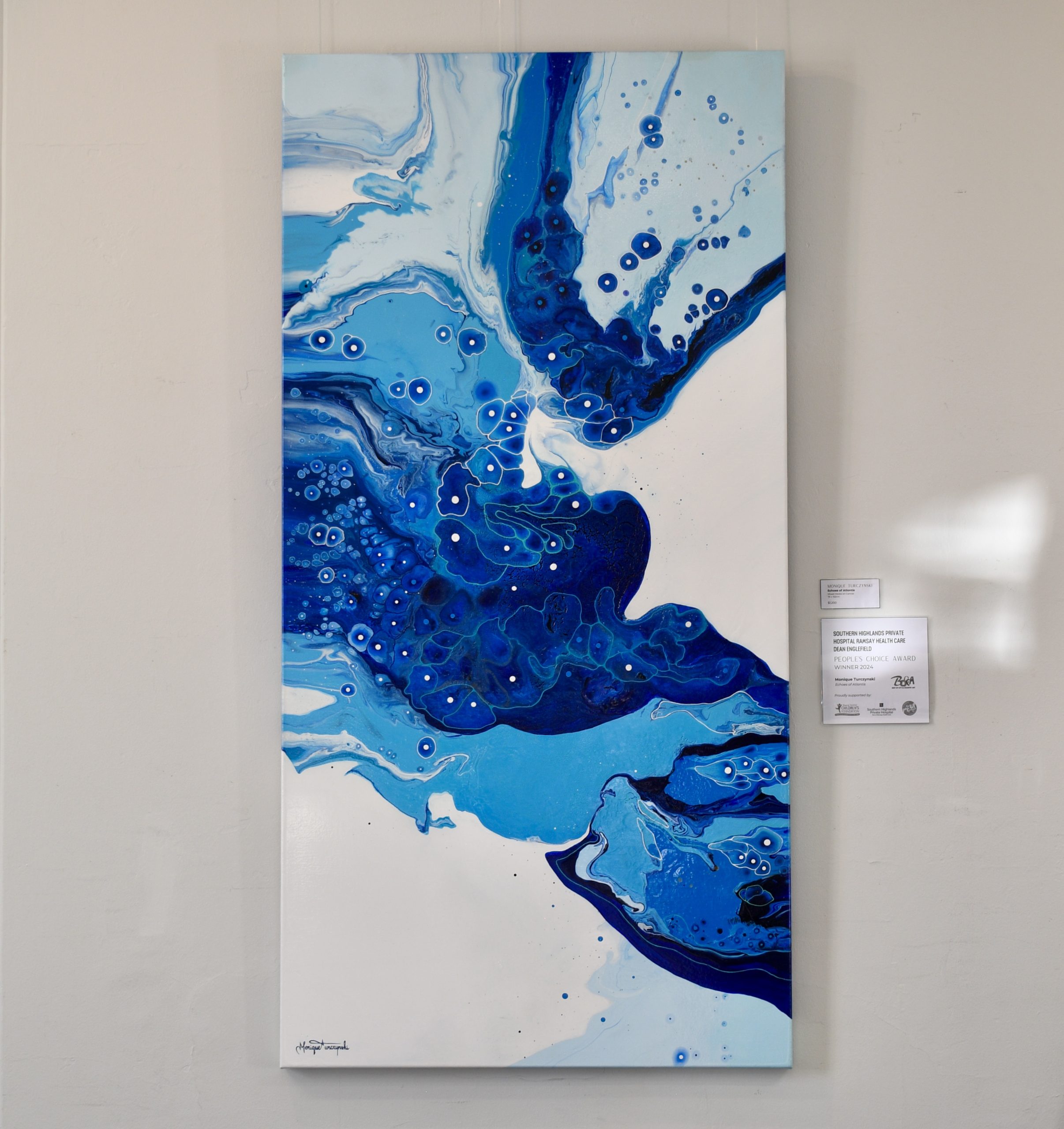 Echoes of Atlantis abstract acrylic painting in deep blue, turquoise, and white fluid patterns, inspired by the mystery of the ocean and the lost city.